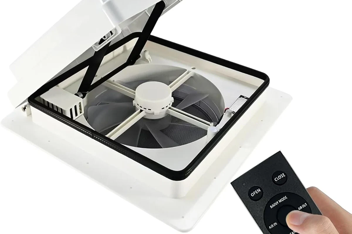 Camper roof vent fan replacement on an RV ceiling with tools and wiring nearby