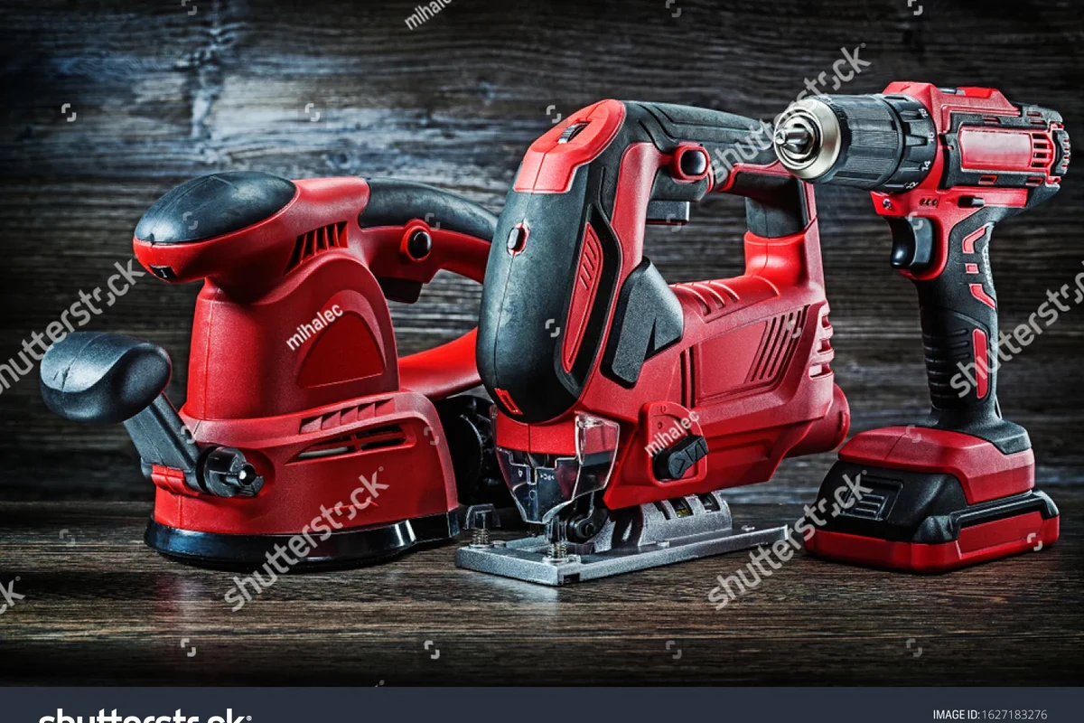 Ryobi stick vacuum mounted on a wall in a tidy home utility room for storage
