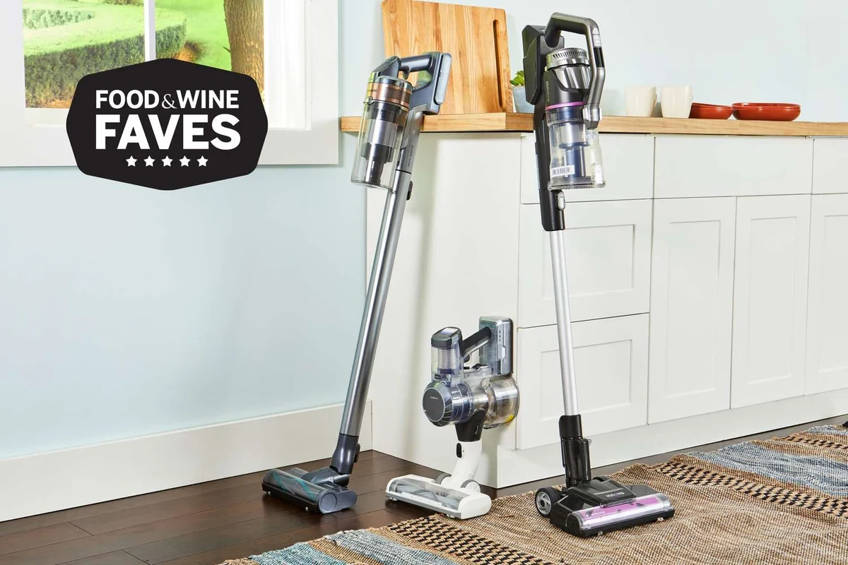 Ryobi stick vacuum mounted on a wall in a tidy home utility room for storage