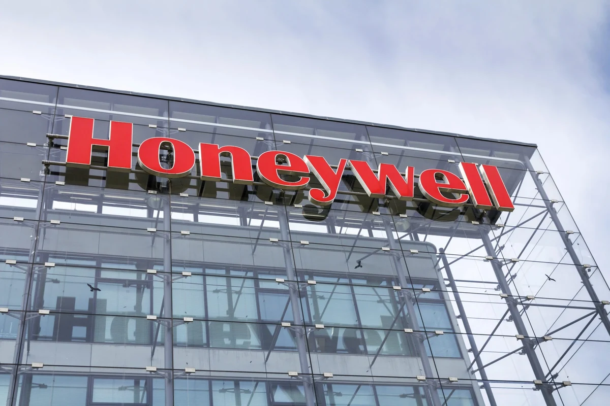 Honeywell cool moisture humidifier placed in a bedroom beside a bed