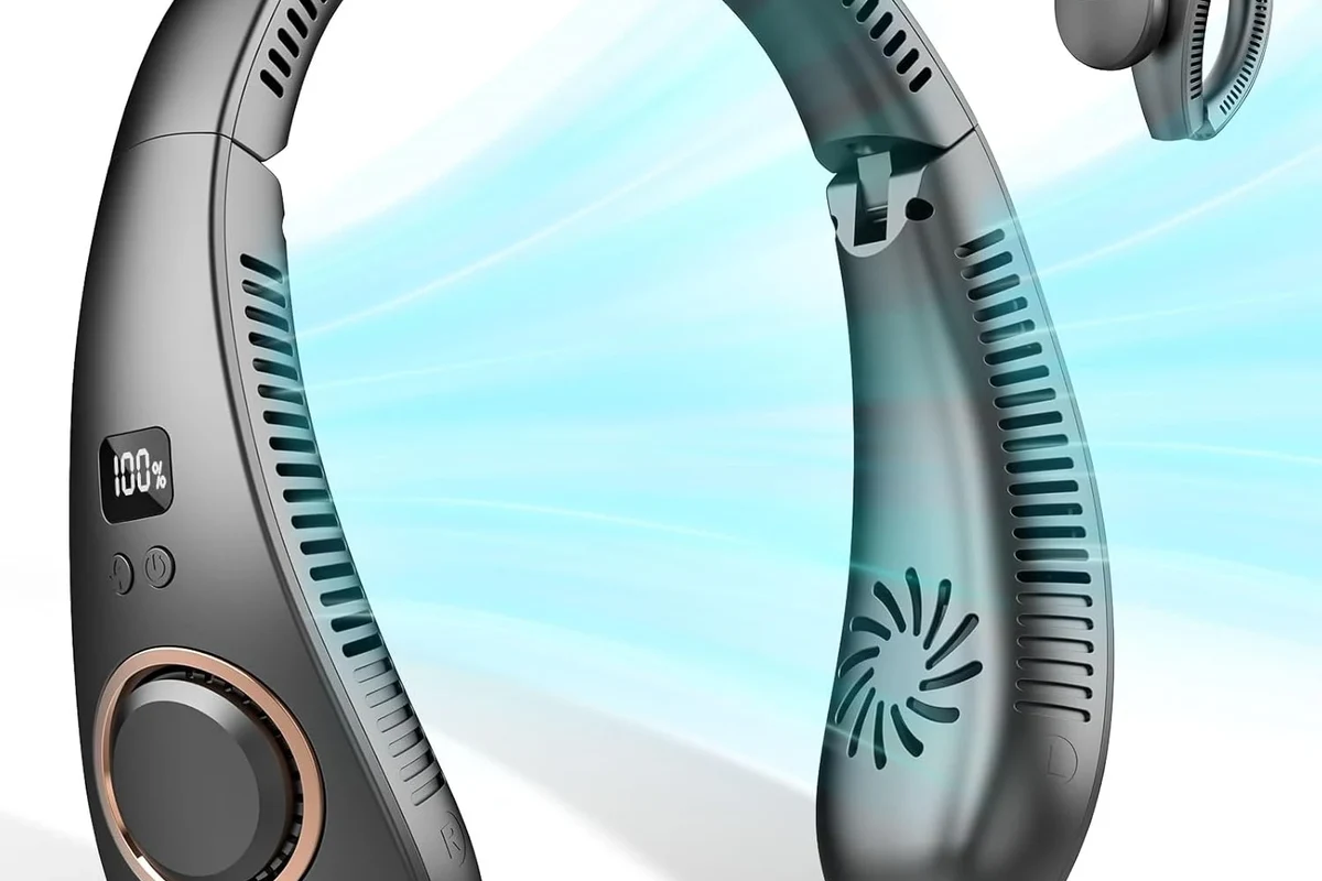 Traveler wearing a rechargeable neck fan in an airport terminal before boarding