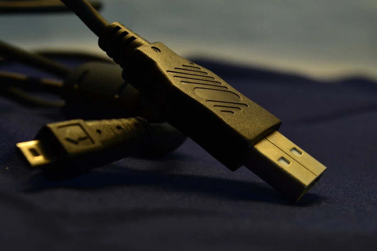Phone charging wirelessly through a slim protective case on a desk charger