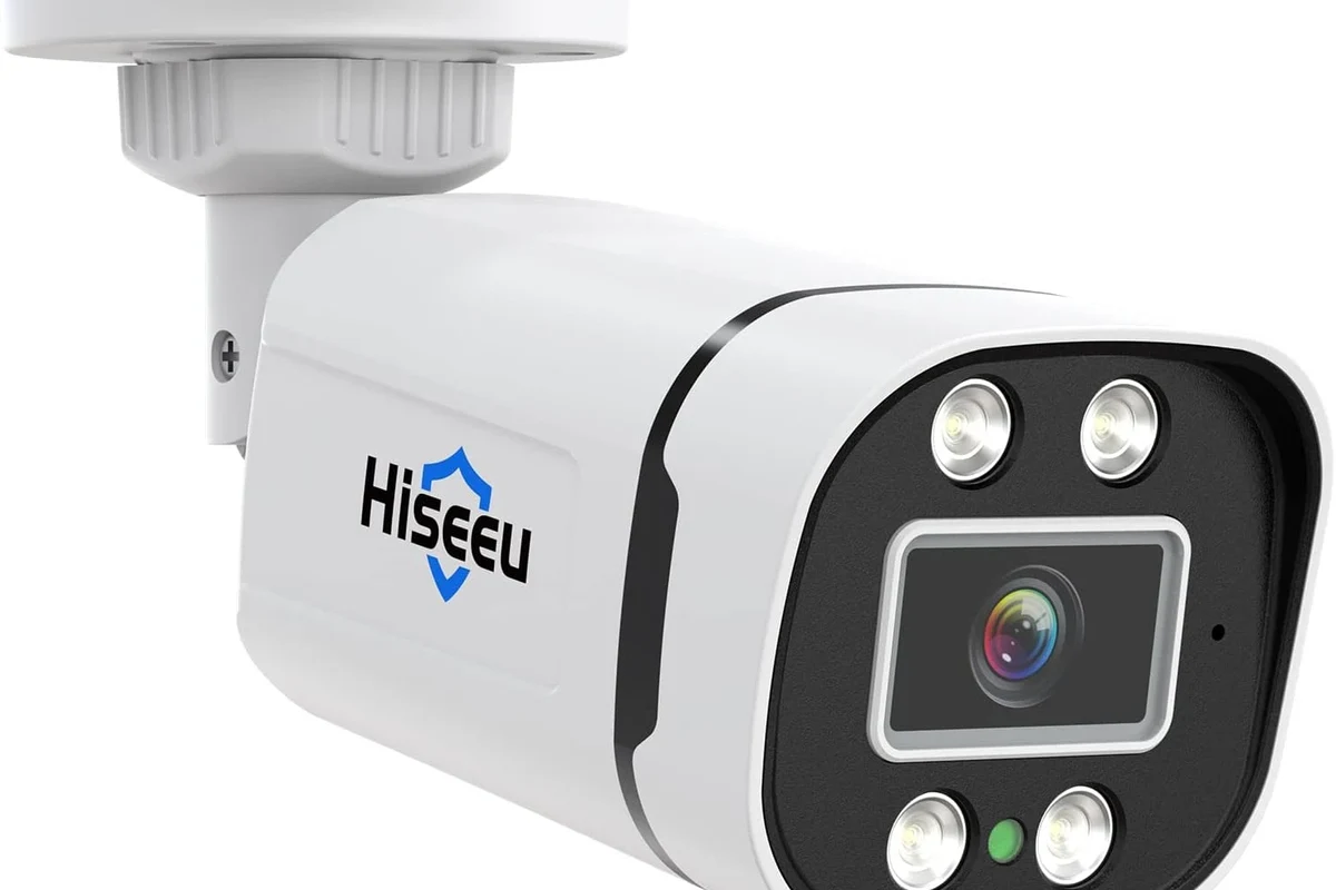 AHD security camera mounted outdoors beside a home entrance for wired surveillance