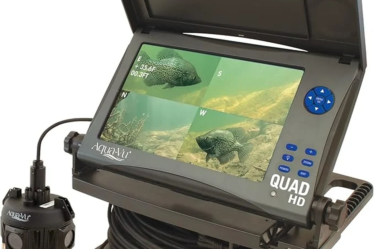 Underwater fishing camera on cable showing live fish-view display beside tackle gear