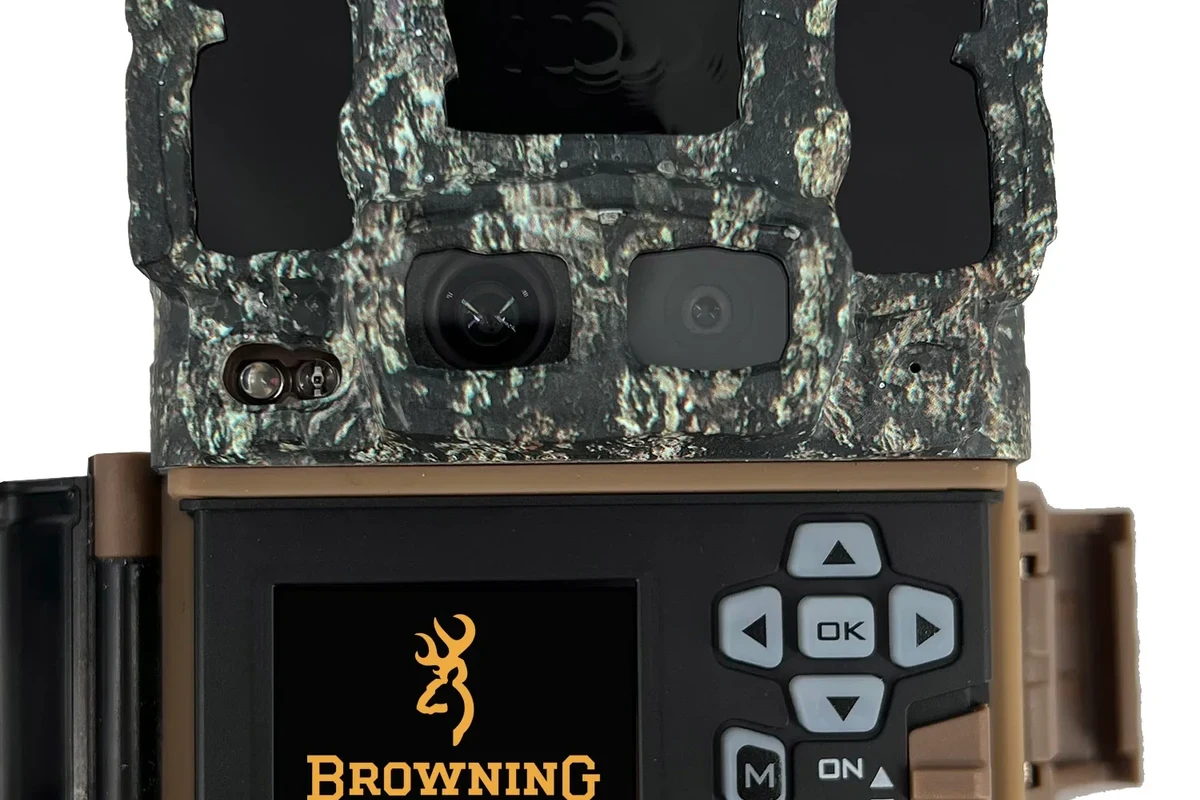 Compact Browning Dark Ops DCL Nano trail camera mounted on a tree for discreet outdoor monitoring