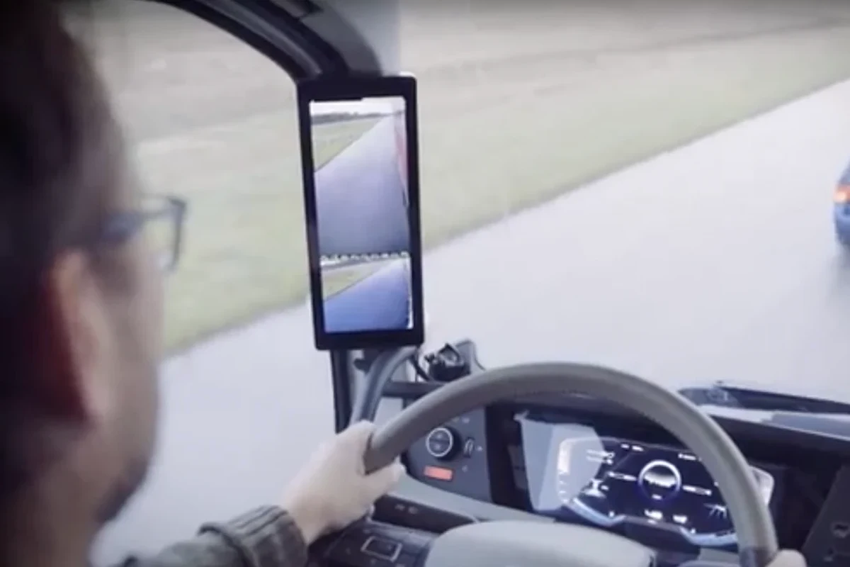 Semi-truck with mirror-mounted cameras and in-cab displays for blind-spot visibility