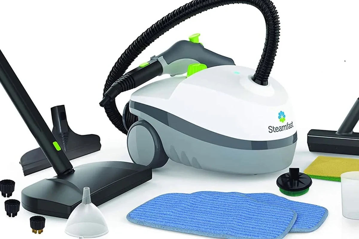 Steam cleaner nozzle treating mattress seams and bed frame crevices for bed bug control