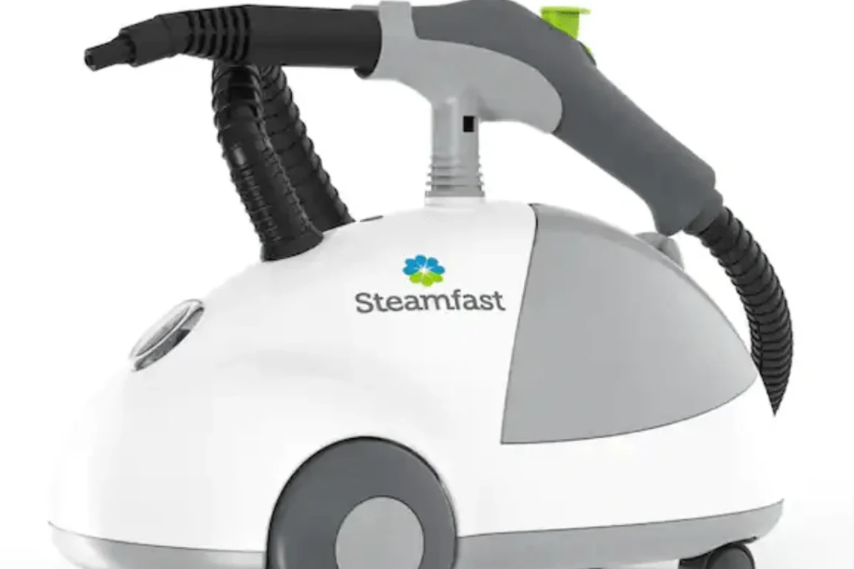 Steam cleaner nozzle treating mattress seams and bed frame crevices for bed bug control