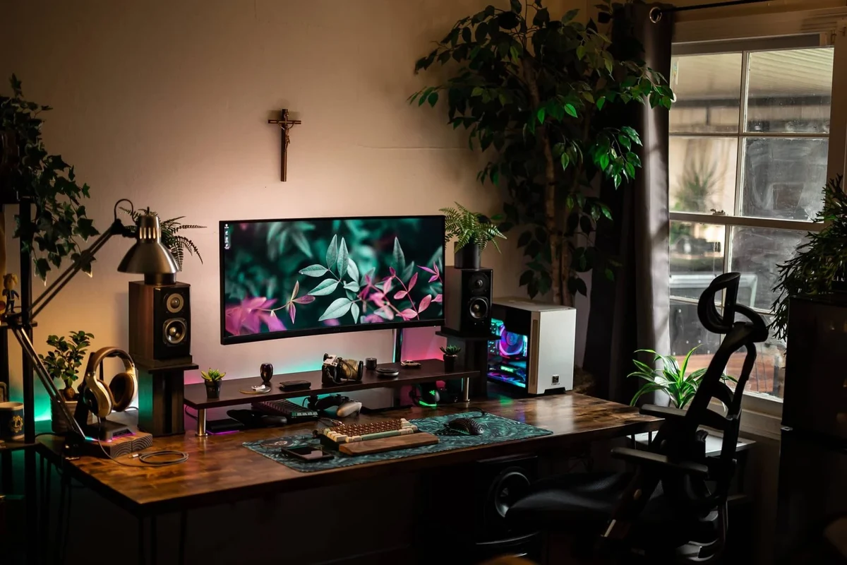 USB fan controller with inline dial connected to a small desk fan on a home office desk