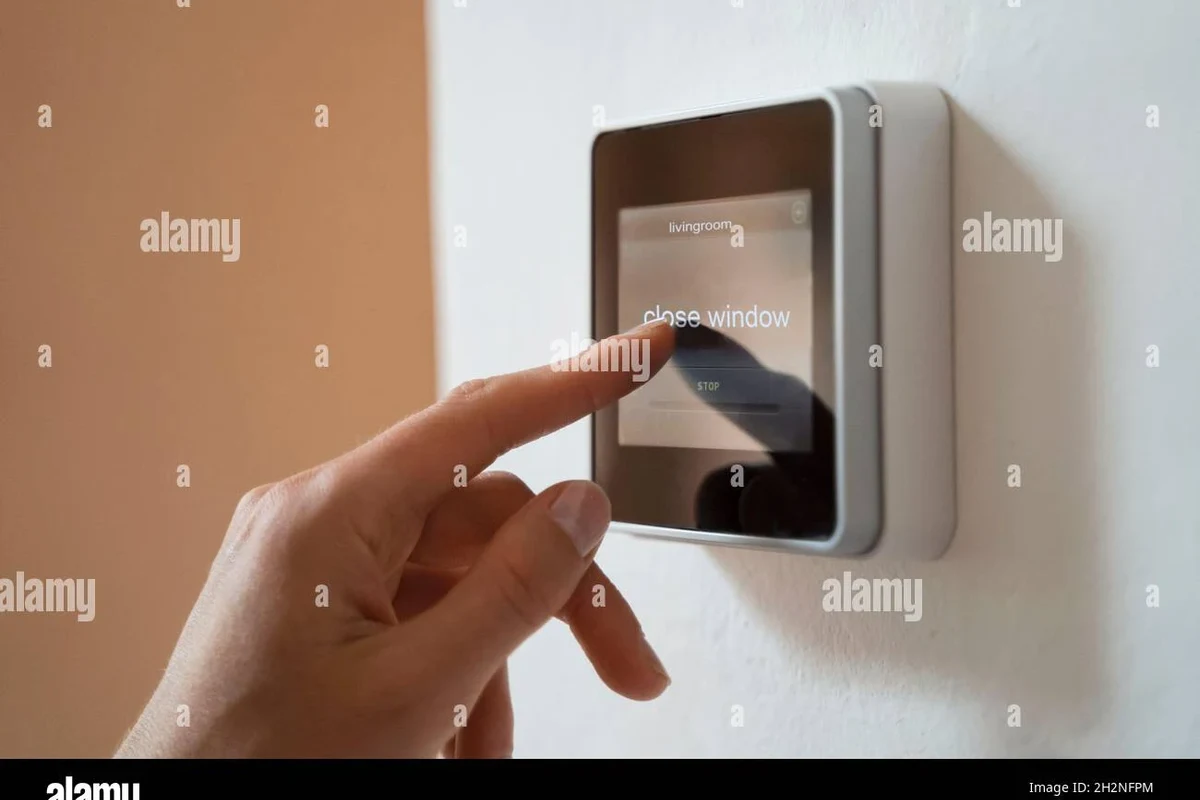 Smart home security camera mounted near a front door with visible deterrent signage