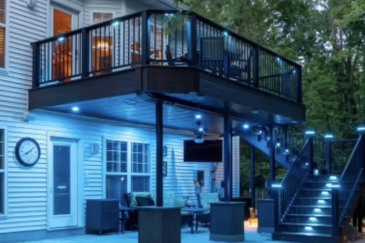 Smart landscape lighting controller and outdoor path lights in a modern yard at dusk