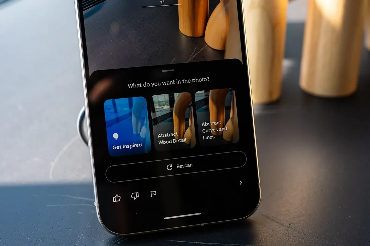 Smart home camera on a shelf with a phone showing live viewing in a modern home