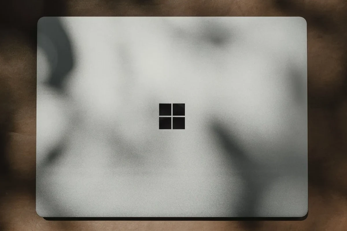 Smart camera connected to a Windows 11 PC with troubleshooting setup on the desk