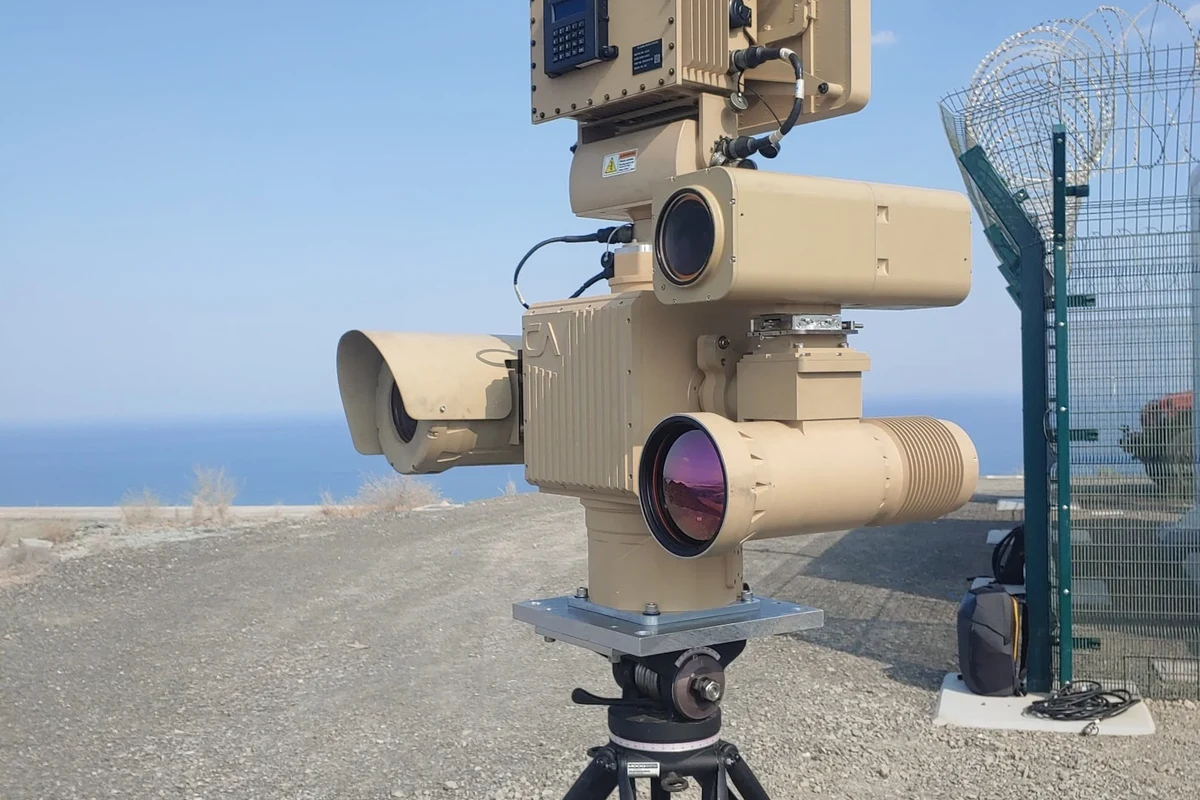 Outdoor rugged security camera mounted on a house exterior with weather-resistant housing