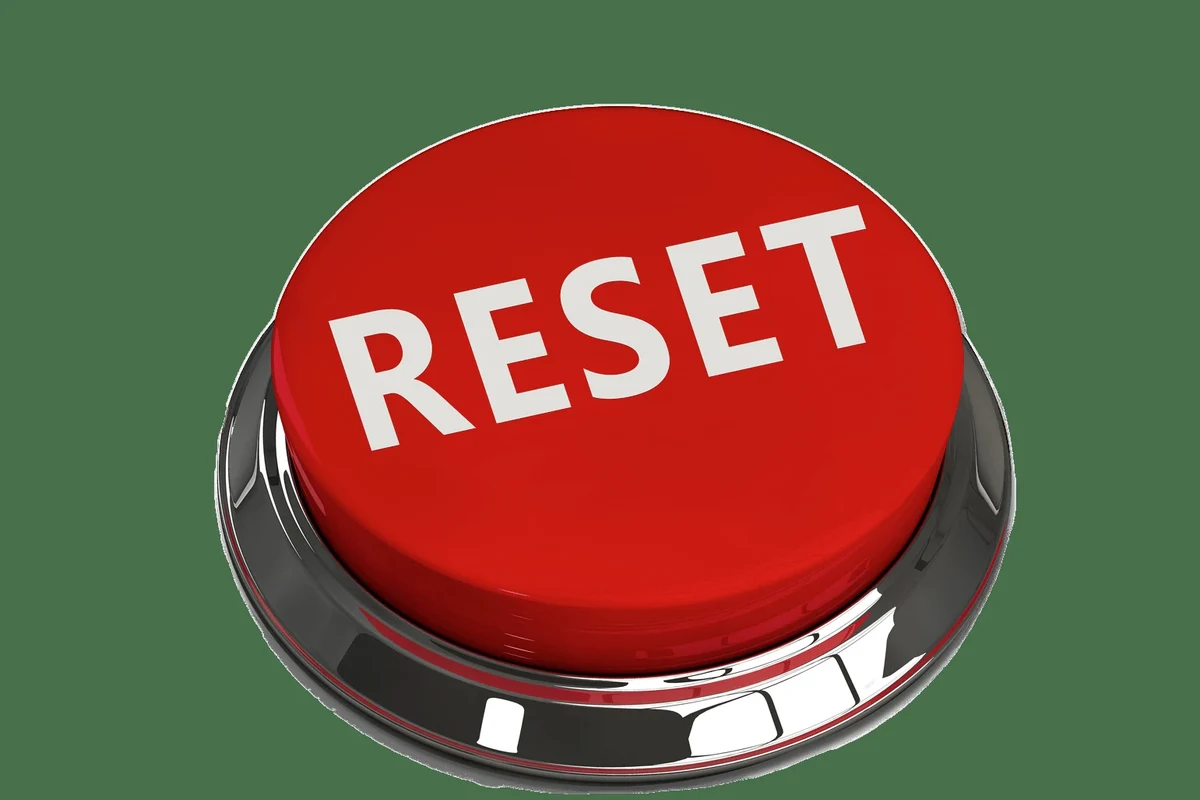 Person resetting a Govee smart plug while checking Wi-Fi setup on a phone