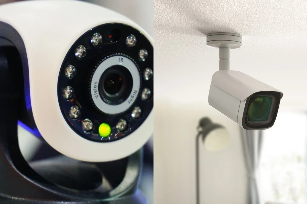 Round green light glowing on a modern security camera mounted indoors