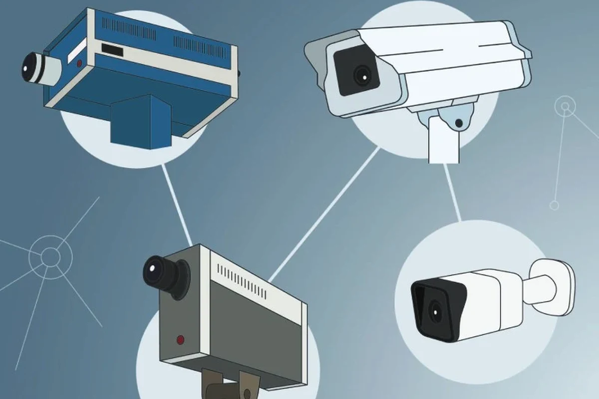 Modern smart home security camera mounted near a front door with app monitoring on a phone