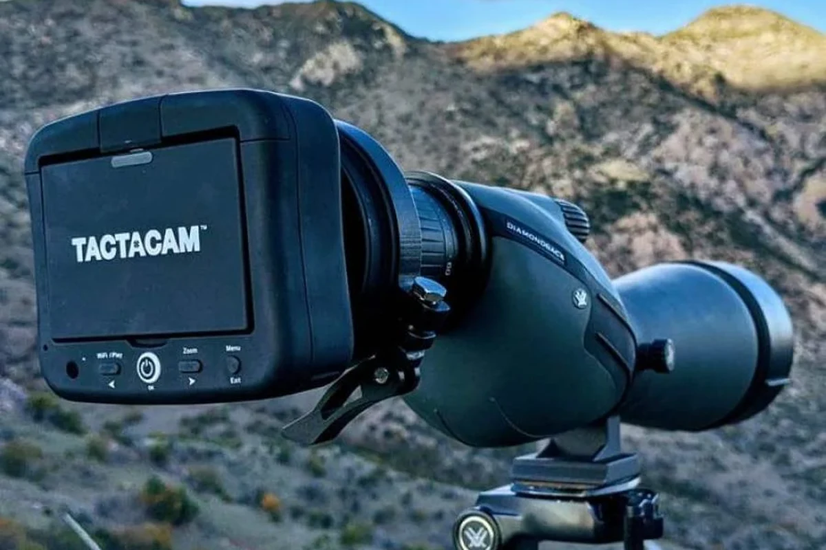 Tactacam scope camera mounted on a rifle scope for shooting video recording