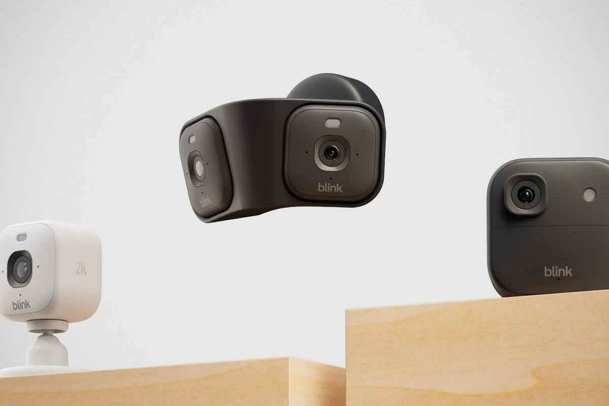 Blink camera with AA rechargeable Eneloop batteries on a smart home desk setup