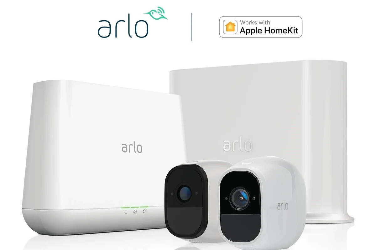 Arlo video doorbell mounted beside a front door with Apple Home app integration on a smartphone