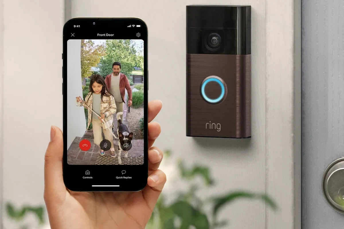 Battery operated video doorbell mounted beside a front door for home security