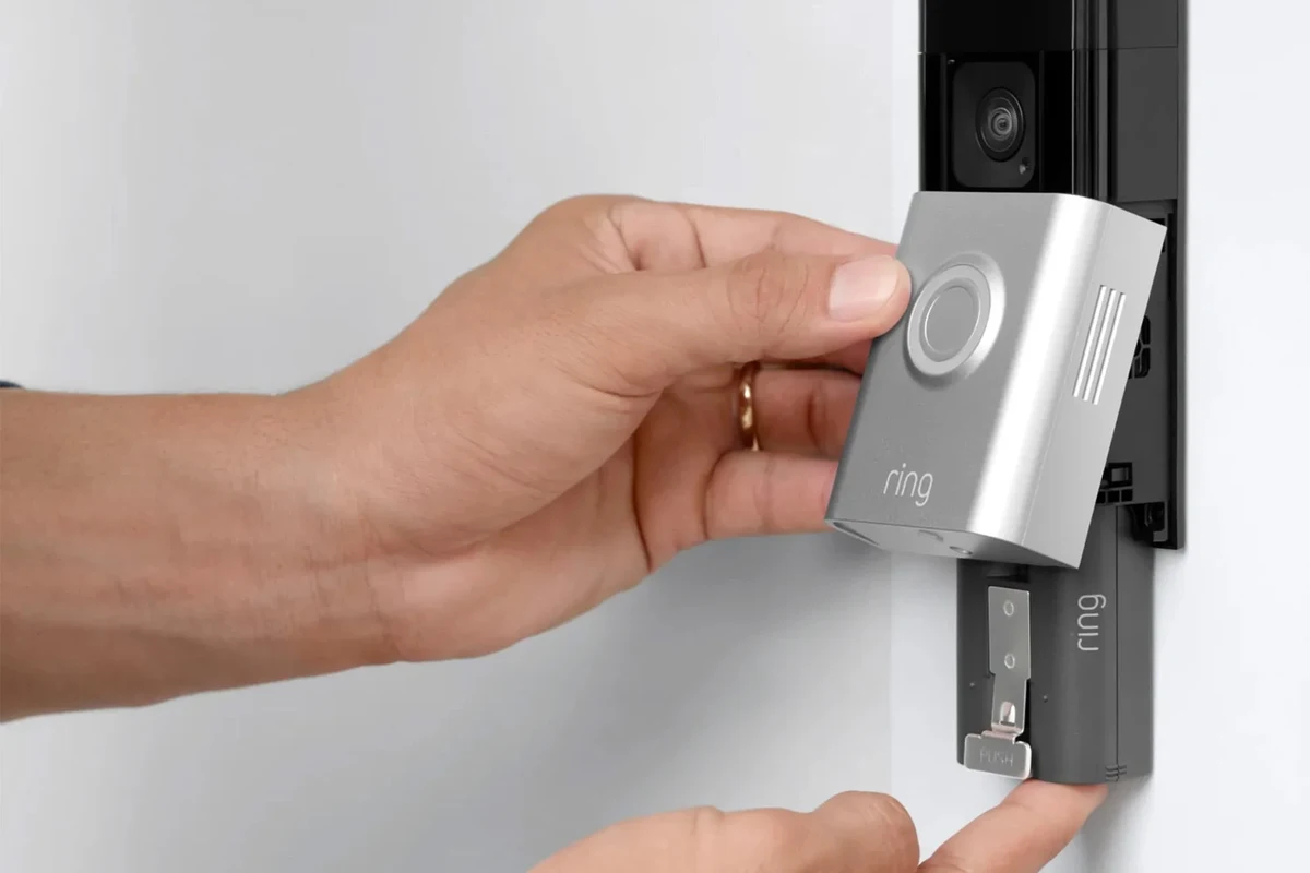 Battery operated video doorbell mounted beside a front door for home security