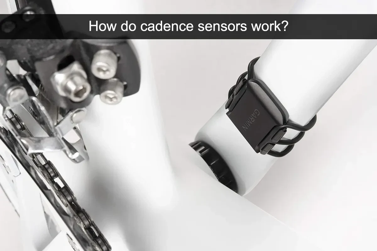 Cyclist checking cadence data on a bike computer during an indoor training ride