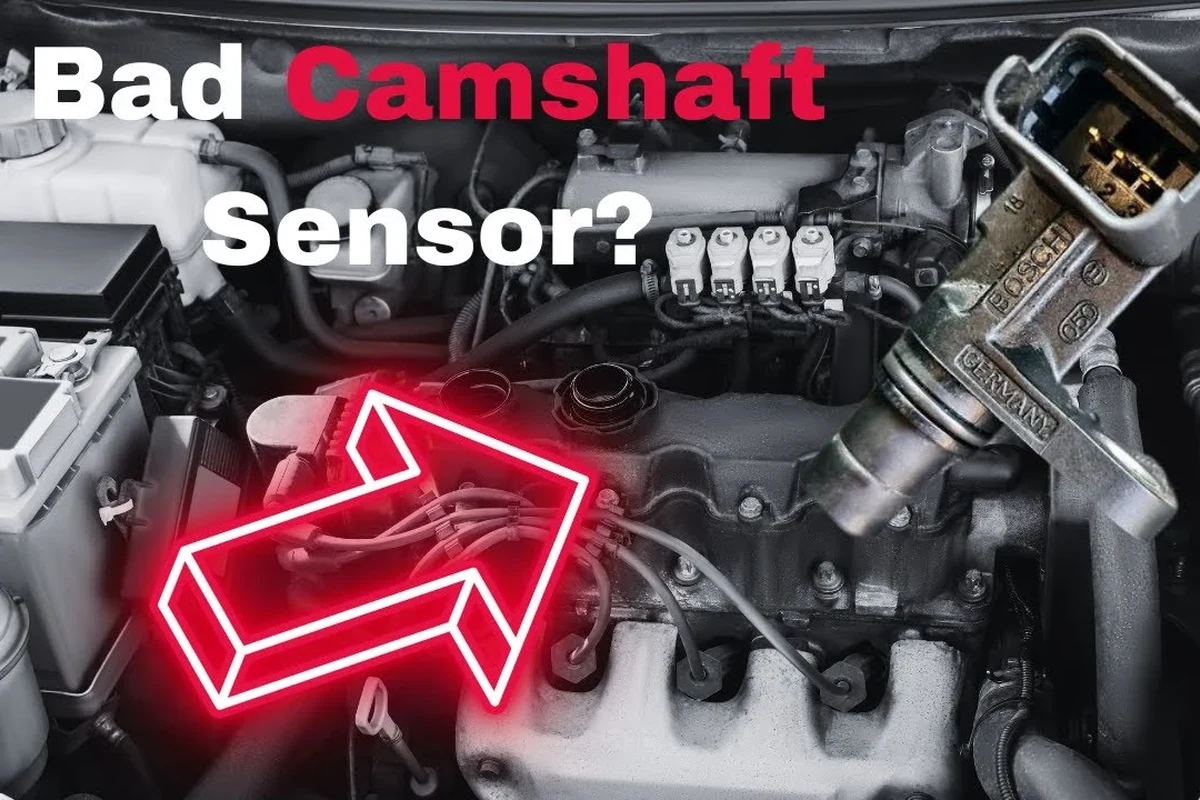 Mechanic-style diagnostic view of an engine camshaft sensor and wiring near a car engine