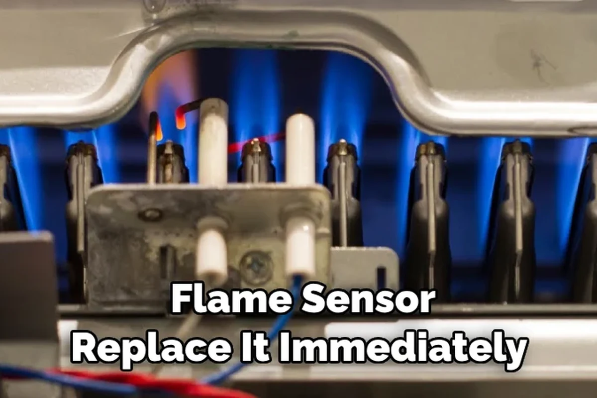 Close-up of a furnace flame sensor rod inside a heating system during inspection
