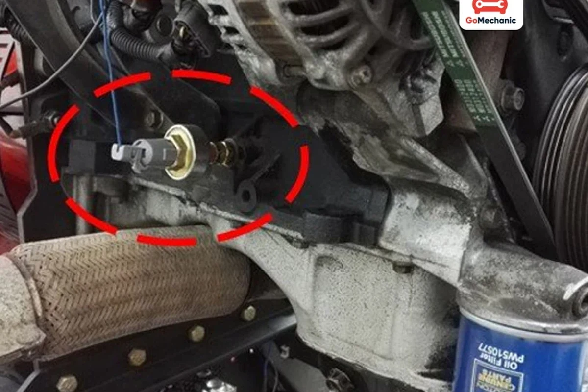 Mechanic-style view of an engine sensor and diagnostic scan tool for rough idle troubleshooting