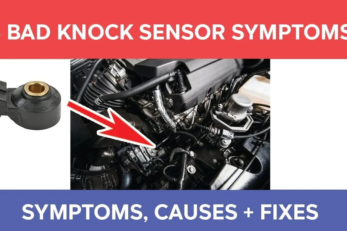 Mechanic inspecting engine sensor wiring near a vehicle transmission bay