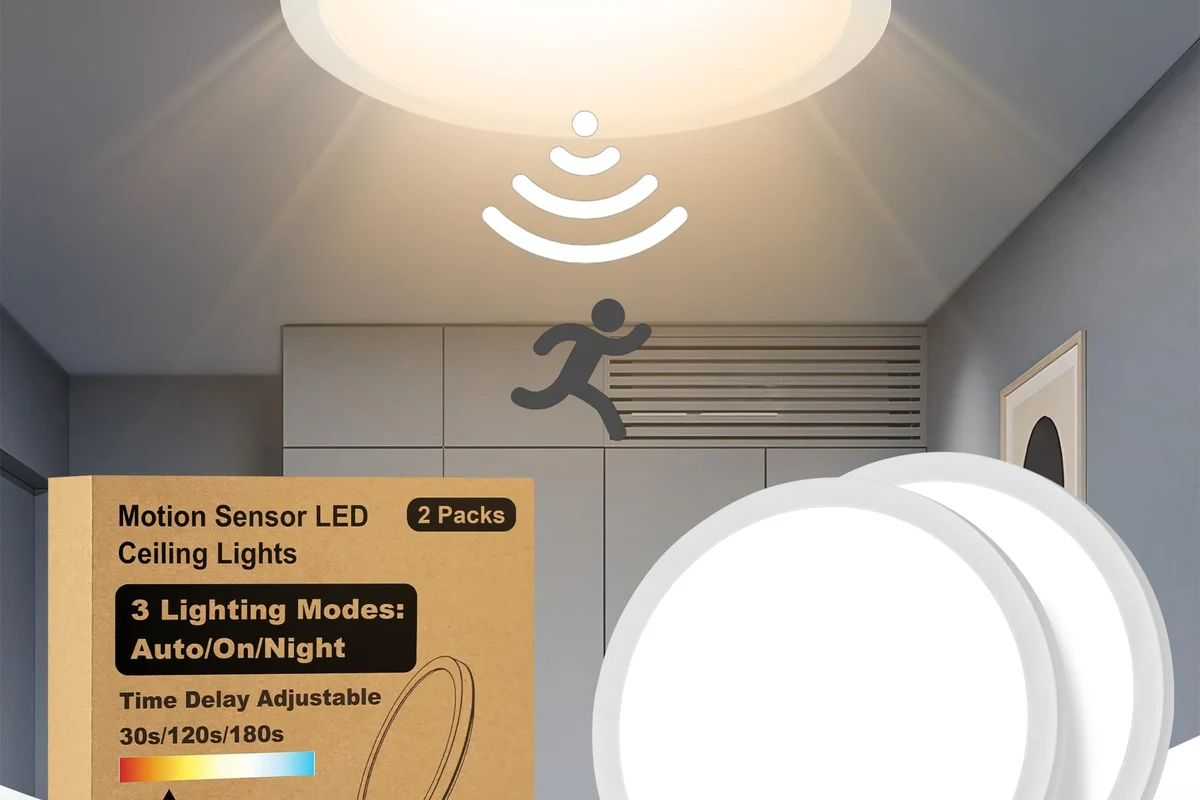 Motion sensor light mounted outdoors near a porch with visible sensor housing