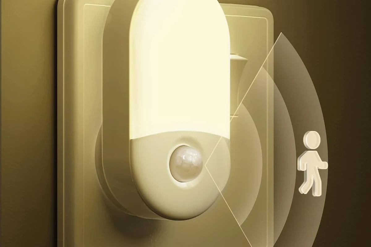 Motion sensor light mounted outdoors near a porch with visible sensor housing