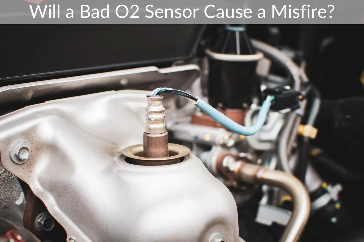 Mechanic diagnosing an O2 sensor and engine misfire with an OBD2 scanner in a car engine bay