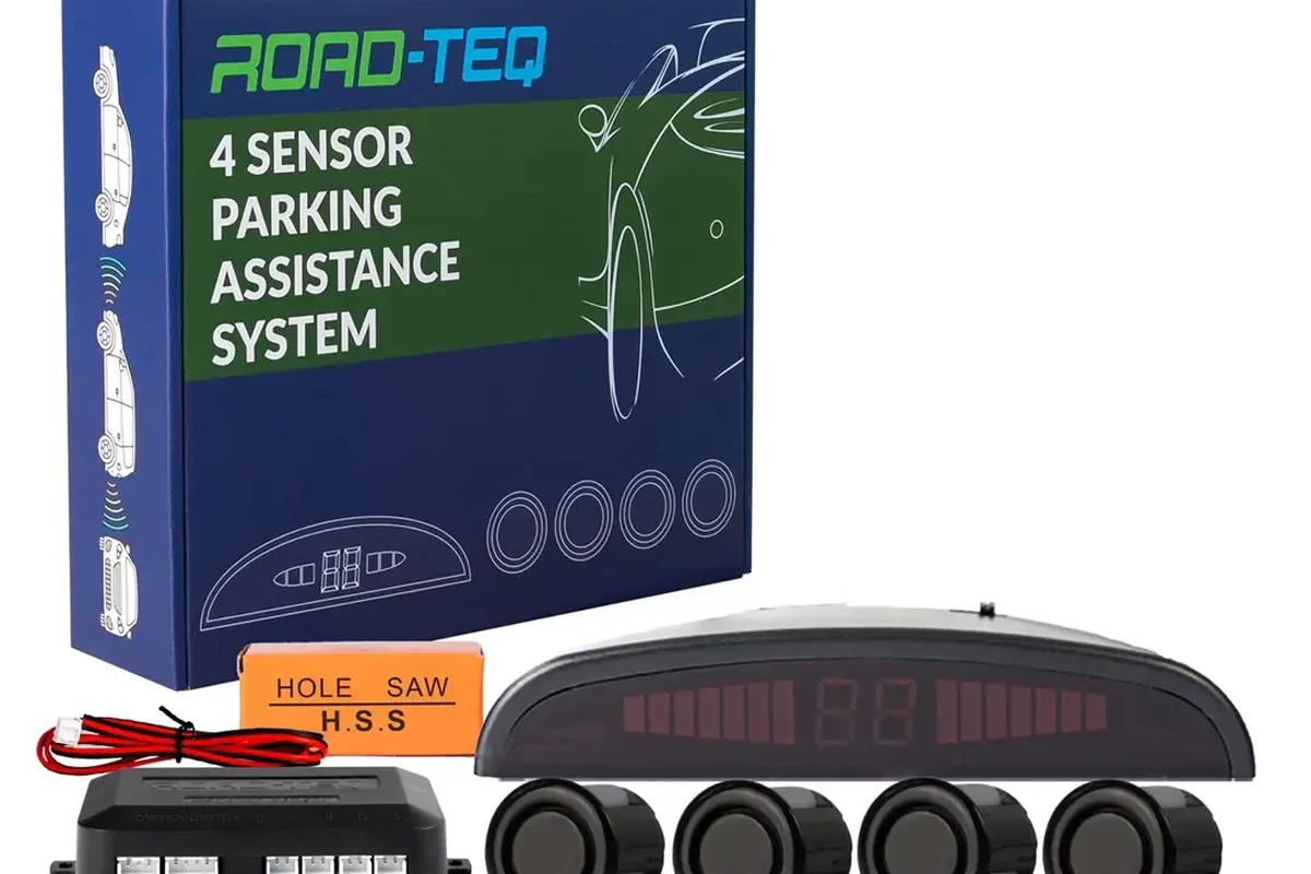 Car parking sensor on a bumper helping detect an obstacle in a tight parking space