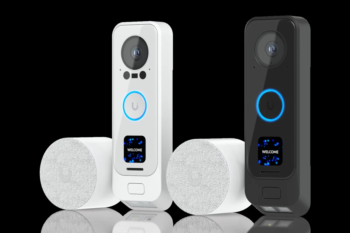 PoE video doorbell mounted at a front entry beside a wired Ethernet connection