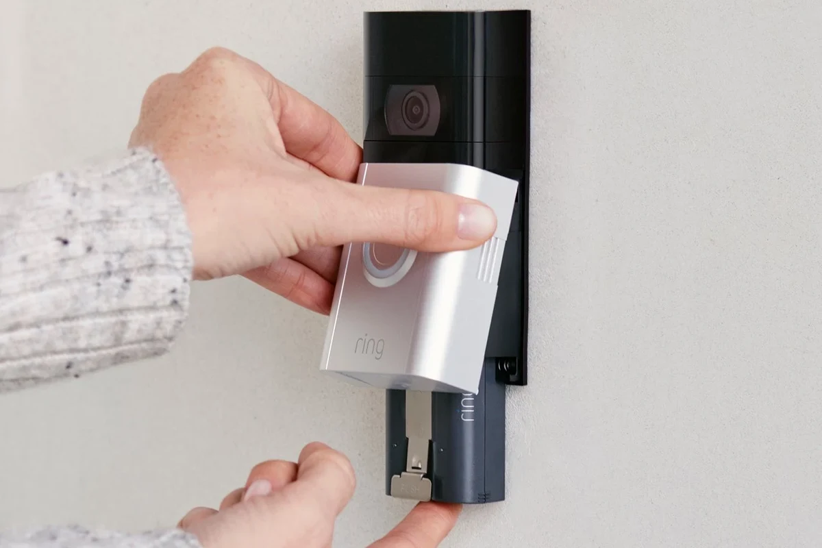 Ring Video Doorbell 2 mounted on a front door with a removable rechargeable battery concept