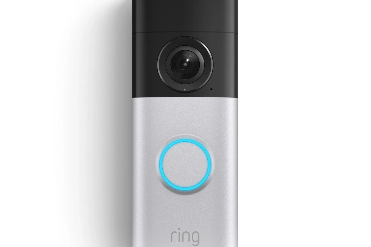 Modern Ring video doorbell mounted on a home entryway beside a front door