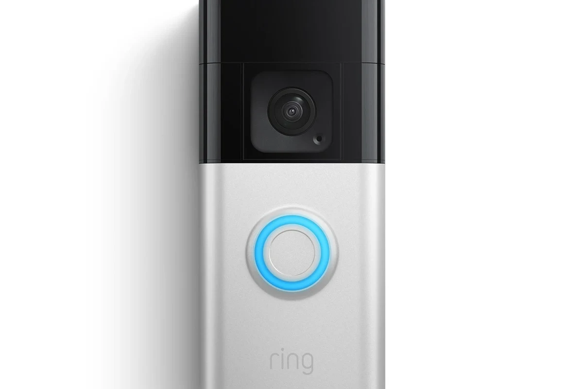 Modern Ring video doorbell mounted on a home entryway beside a front door