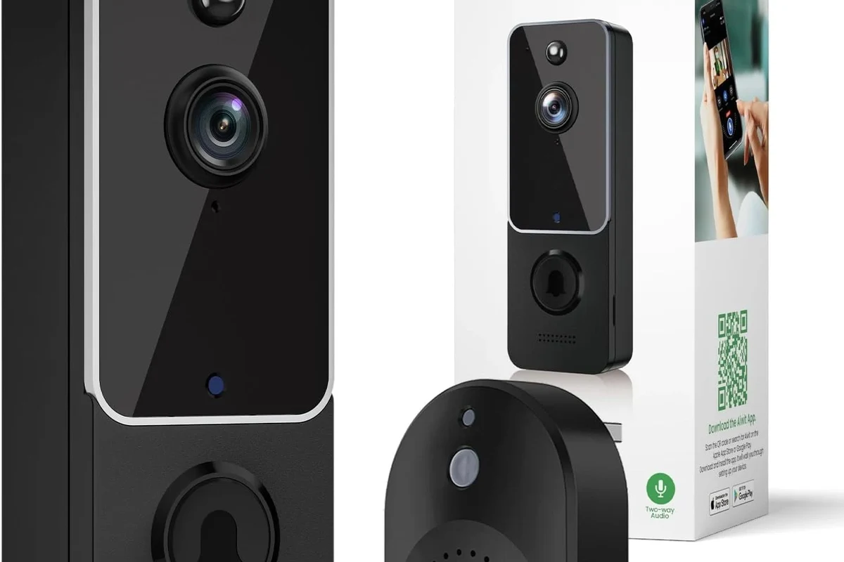 Modern video doorbell on a home entryway with a smartphone showing front-door alerts