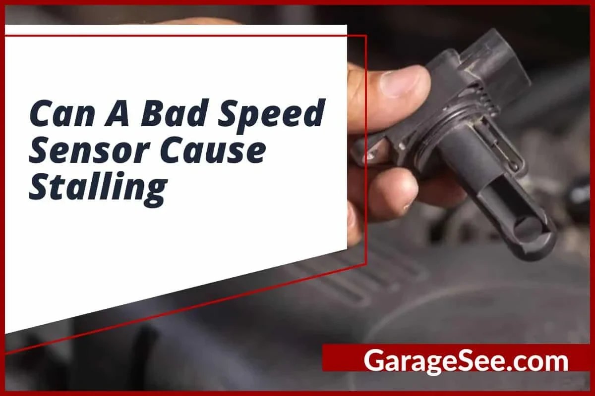 Mechanic inspecting a vehicle speed sensor and wiring near a transmission