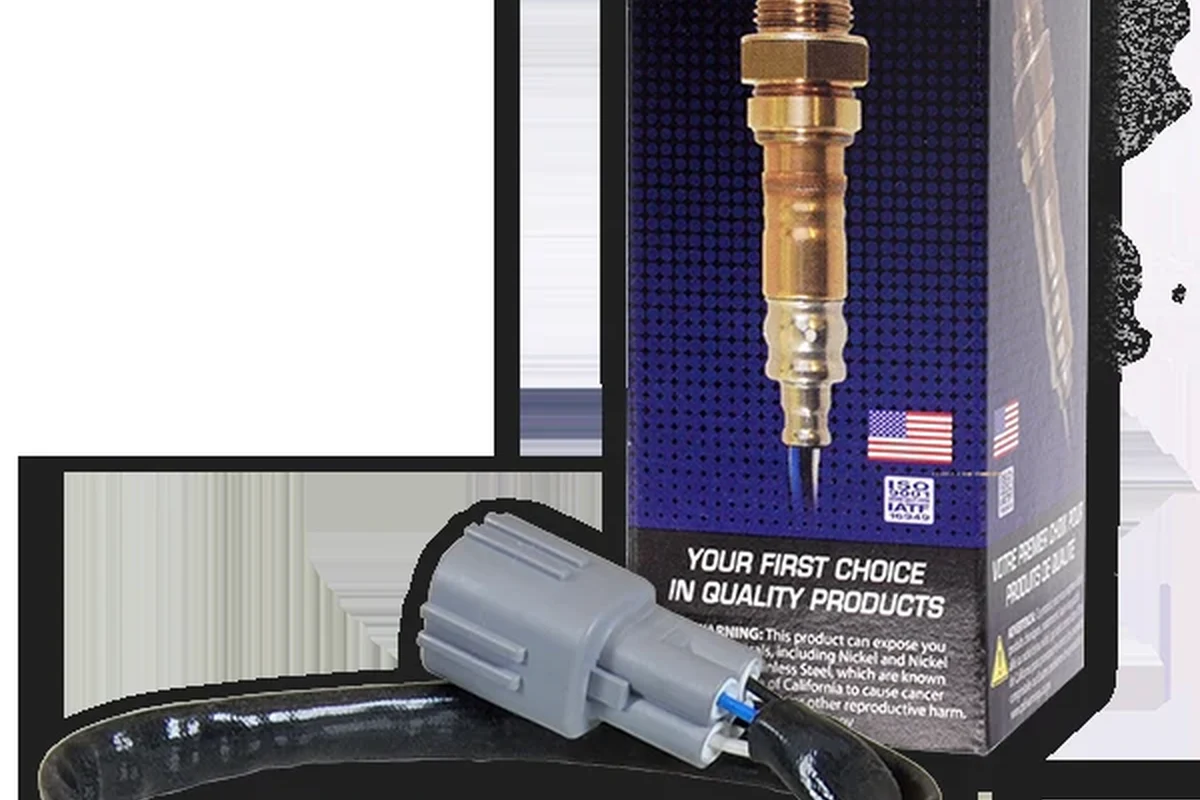 Mechanic replacing an oxygen sensor on a car exhaust system
