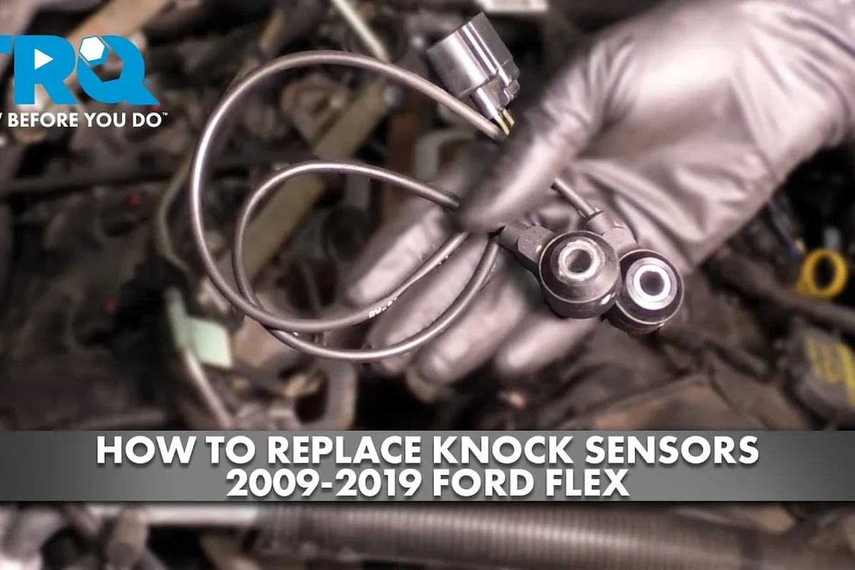 Mechanic-style view of a car engine with a sensor replacement area highlighted