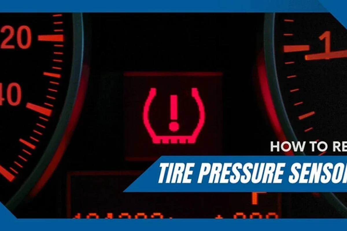 Dashboard tire pressure warning light with a tire gauge beside a car wheel