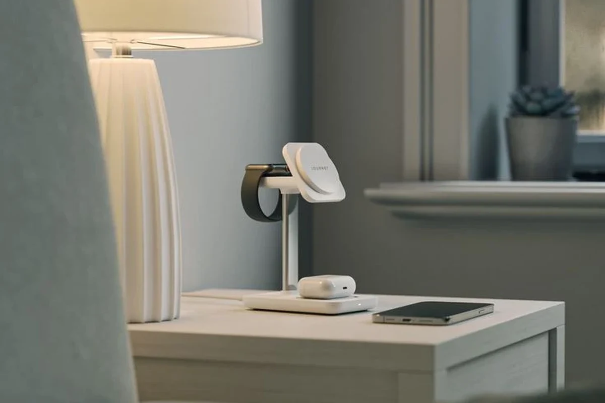 USB-C phone charger and cable beside a smartphone on a clean desk