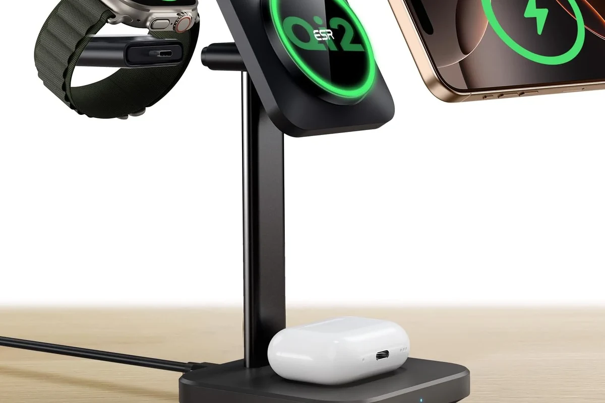 iPhone charger and cable on a clean desk beside a modern smartphone