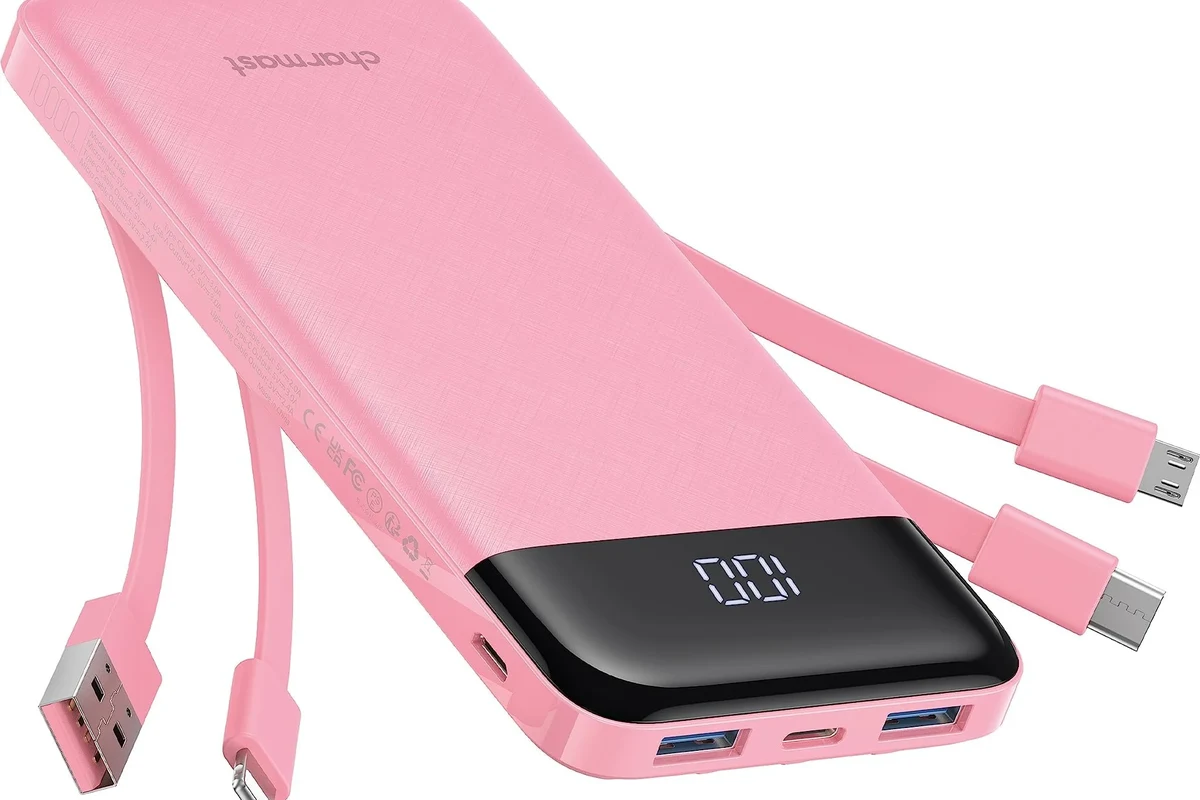 USB-C charging cable warming near a laptop and phone on a desk