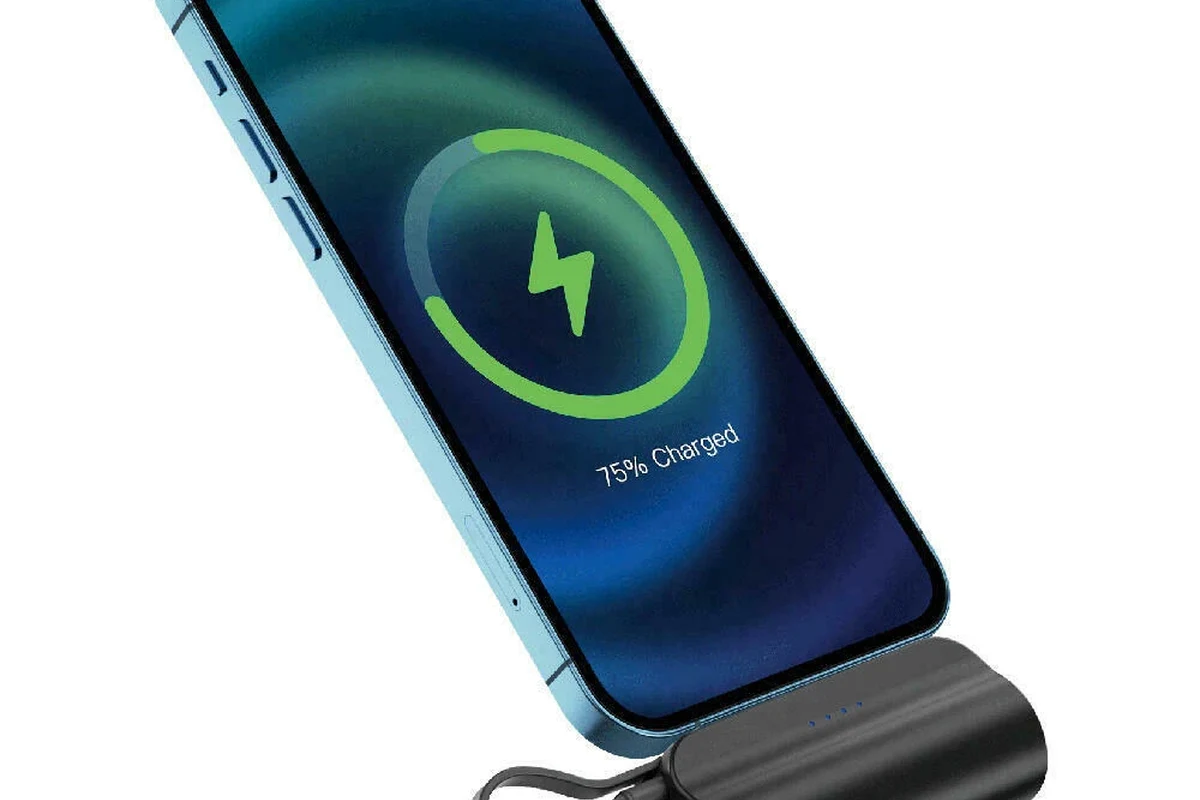 USB-C cable connected to a laptop for charging on a clean desk
