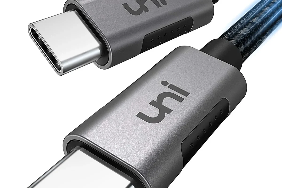 USB-C cable connected to a charger and device while troubleshooting slow charging