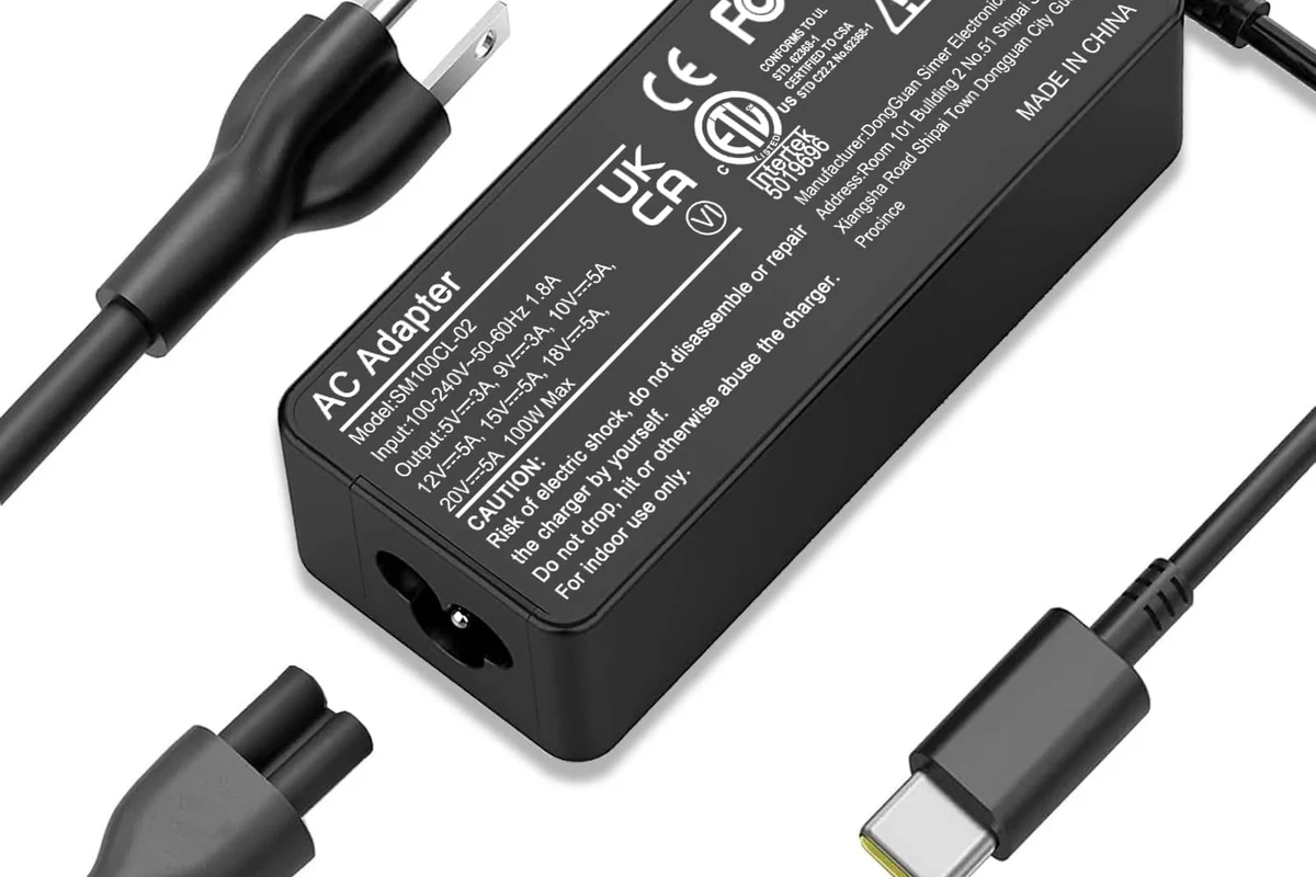 USB-C laptop charging cable connected to a modern notebook on a desk